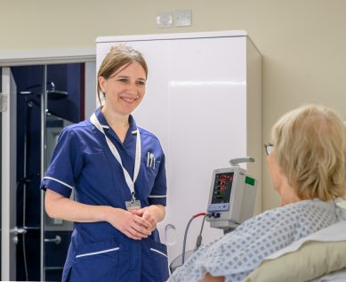 Nurse talks with patient