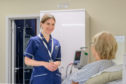 Nurse talks with patient