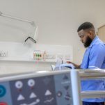 A nurse looking through notes