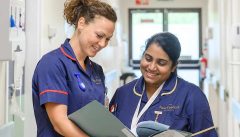 Nurses reviewing patient notes