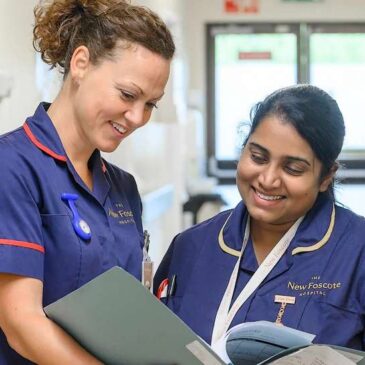 Nurses reviewing patient notes