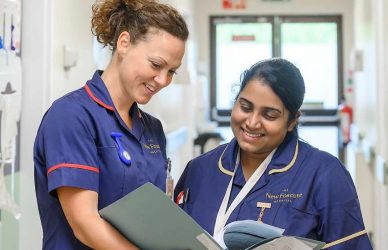 Nurses reviewing patient notes