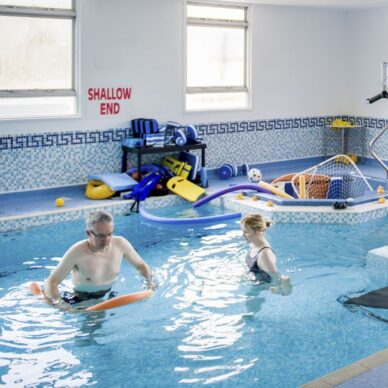 Patient and therapist in hydrotherapy pool