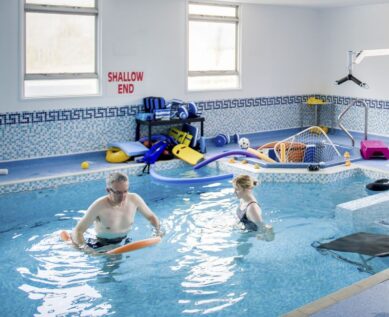 Patient and therapist in hydrotherapy pool