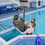 Entering hydrotherapy pool using hoist