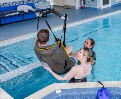 Entering hydrotherapy pool using hoist