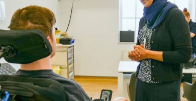 Speech and language therapist with patient