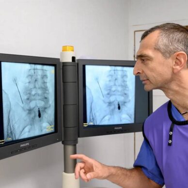 Technician studying x-rays