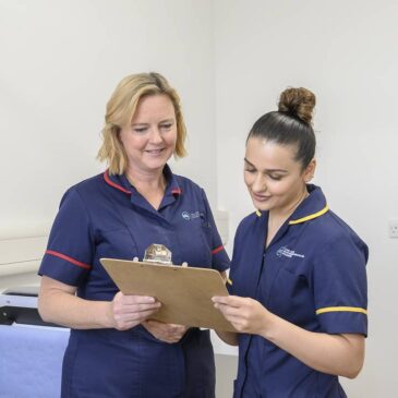 Nurses reviewing medical record