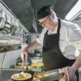 Chef plating meal for patient