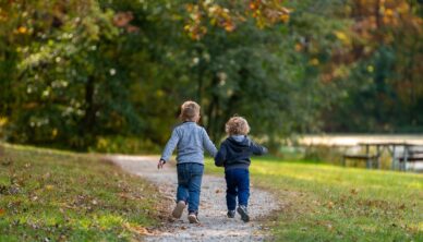 Children running on path in autumnn