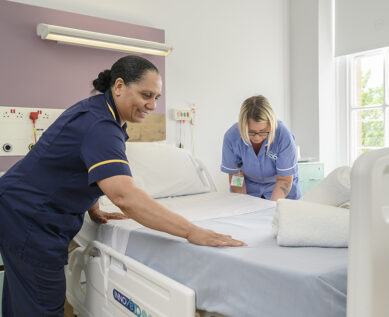 nursing staff making bed