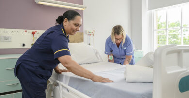 nursing staff making bed