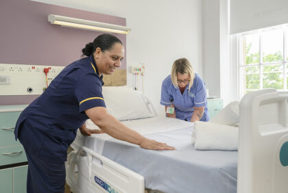 nursing staff making bed