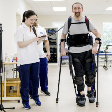 patient wearing exoskeleton