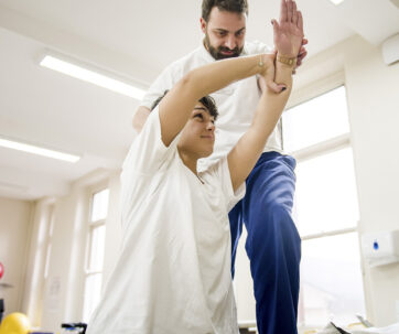 spinal rehabilitation physiotherapist treating patient