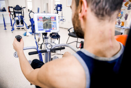 spinal rehab patient using FES bike